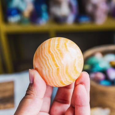 Banding Orange Calcite Sphere